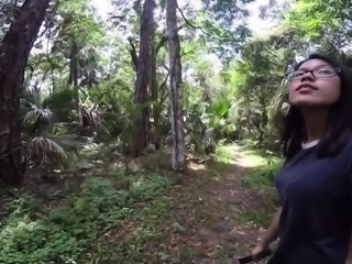 Nerdy Asian teen satisfies her interracial lust in the woods