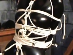 Post tied and ballgagged in catsuit