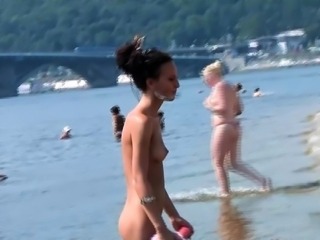 Bombastic young nudist babes sunbathe nude at the beach