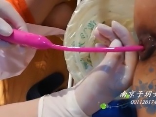 Beautiful Female Surgeon With Surgical Gloves Fisting