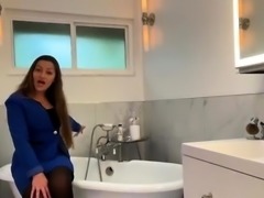 Enticing mom vibrating her pussy to orgasm in the bathroom