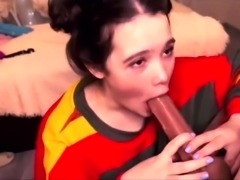 Kinky brunette teen deepthroats a huge dildo on webcam