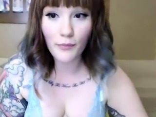 Busty curly brunette with big boobs fucks on couch