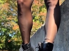 Sensual foot fetishist poses in nylons and black boots