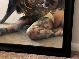 Tattooed couple having wild sex in front of the mirror