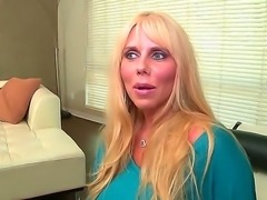 Loose blond mommy Karen Fisher comes rocking a bust too big to be avoided by porn biz. See her in this classy solo video of hers  talking about herself and petting those tits too!