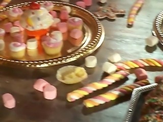 The whole of this table is loaded with sweets but fairy tale honeys Ash Hollywood and India Summer are only interested in one lollipop. The one hiding in their buddys pants!