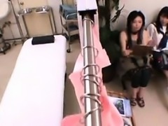 Asian Teen Examined Closely By A Doctor