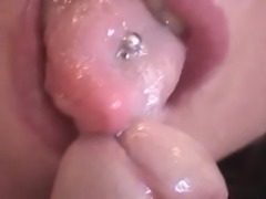 Beauty is giving a juicy blowjob in close-up 