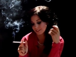 Dark-haired bombshell gives a hot blow job while smoking a
