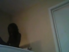 Dark woman on Hidden Camera in room