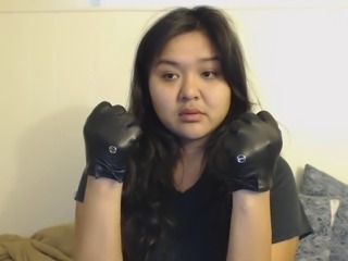 dee tries on leather gloves