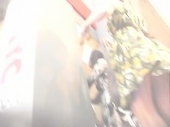 Voyeur uses a spycam to take upskirt shots of a sexy brunet