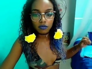 Sexy ebony blows a kiss to the camera and gives a peek of h