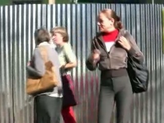 Russian brunette chick in black pants pisses on the sidewalk