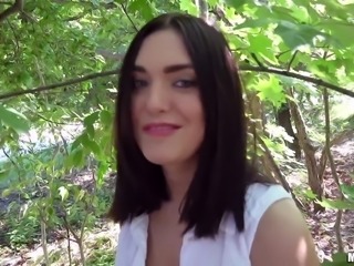 Jenny Sapphire gives a blowjob outdoor in woods