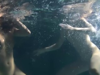 Two delicious and naked sluts make out while diving