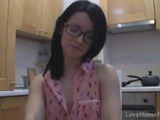 Splendid teen with glasses chatting in the kitchen