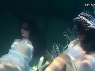 Natural boobs European lesbian swimming with her babe underwater