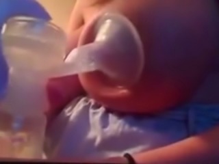 My cute wife was pumping up some milk from her big juggs