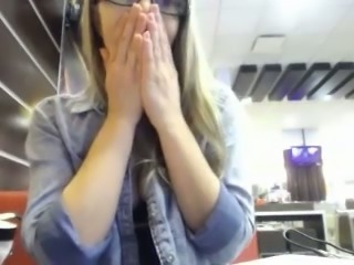 Tempting girl fingering wet cherry in restaurant making amateur video