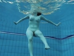 Charming brunette with nice ass in panties shading bra underwater