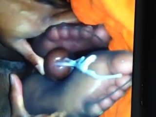 Black nylon footjob with big cumshot