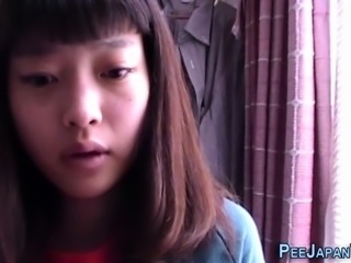 Asian teen drinks piss