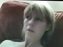 Blonde milf wanks her cunt while watching porn.