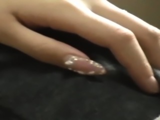 Asian babe rubs herself