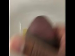Guy pees and masturbates at a urinal