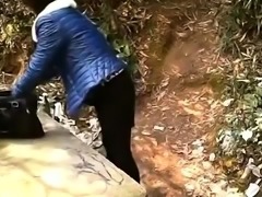 Voyeur spies on a Japanese couple having sex in the outdoors