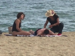 Accidental nip slip after massage on beach
