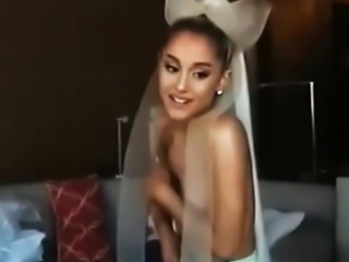 Ariana Grande topless holding her boobs behind the scenes