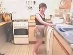 wendy strips in the kitchen while making dinner