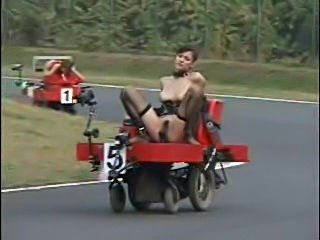 Girls racing around a track while dildo fucked