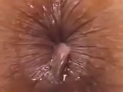 Big zoom  on  a  anus  farting  a  lot  of  sperm ...