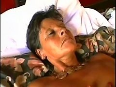 Short haired mature gives blowjob, fucks and receives facial