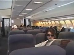 American stewardess gives a asian guy a handjob durningmid flight