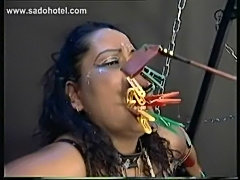 Tied up scared slave with alot of clamps on her face and tit free