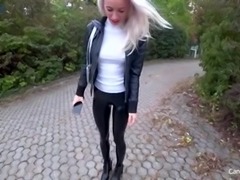 Latex Clad Blonde fucks in a public toilet