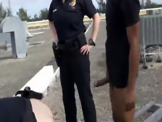 Two nasty female police officers suck large penis of a black felon the