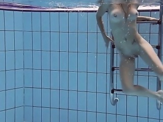 Smoking hot Russian redhead in the pool