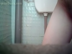 White pale skin pregnant lady flashes her pussy in the toilet